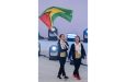 Ceili Peterson and her Coach Yvette Yong carrying the Golden Arrowhead proudly at the Opening Ceremony