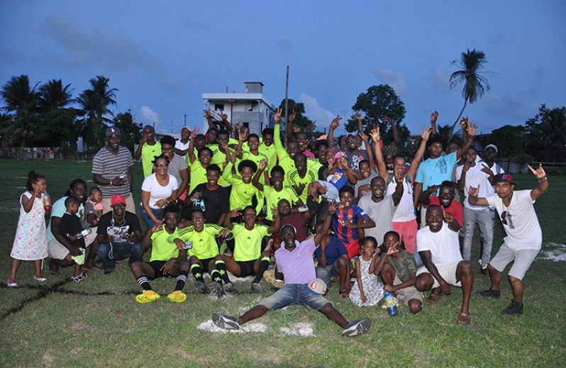Soesdyke Falcons celebrate with their fans and supporters following their 3-2 win over Grove Hi-Tech at the Diamond Community Centre ground.