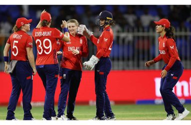 England players celebrate the fall of a wicket