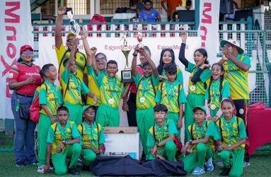 The victorious Huis T’ Dieren Primary School along with officials from ExxonMobil Guyana celebrate their success of winning the Champion of Champions edition