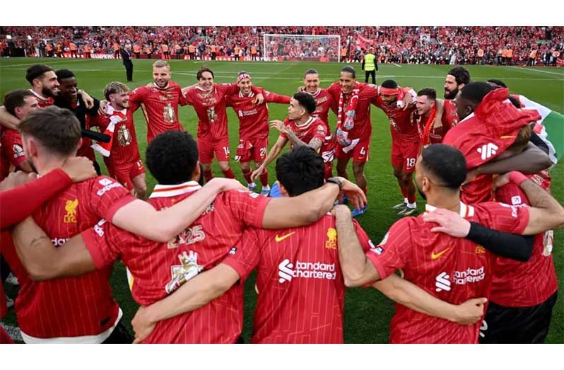 Liverpool's players celebrate clinching the Premier League title.