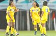 Barbados players celebrate a goal