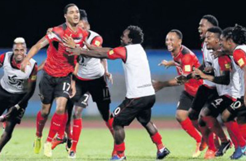 Trinidad and Tobago's Alvin Jones (17) celebrates with teammates after scoring against United States.