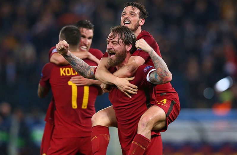 Roma's Daniele De Rossi and Alessandro Florenzi celebrate after the match. Alessandro Bianchi, (Reuters)