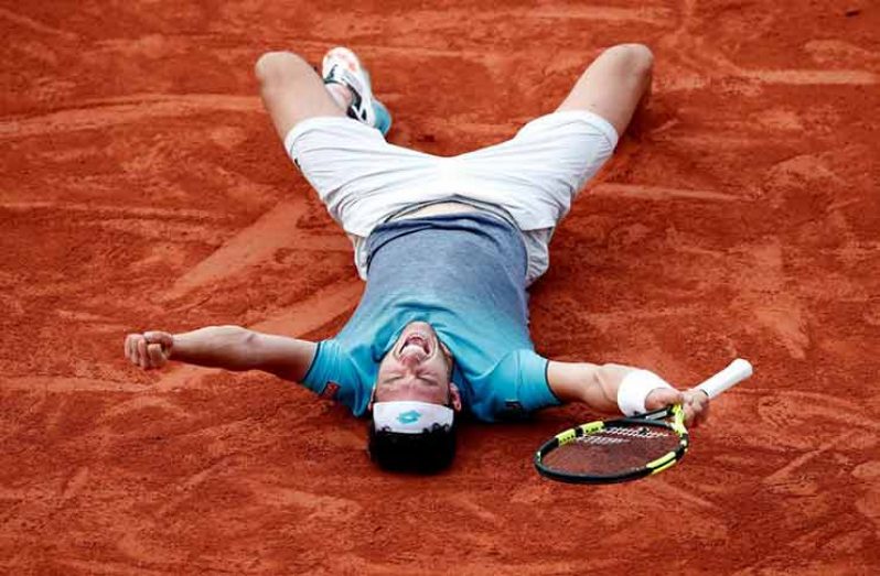 Italy's Marco Cecchinato celebrates winning his quarter-final match against Serbia's Novak Djokovic. (REUTERS/Benoit Tessier)