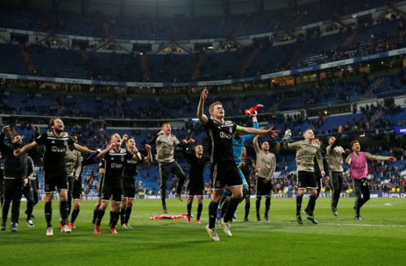 Ajax's Matthijs de Ligt and team mates celebrate in front of their fans at the end of the match v Real Madrid, yesterday.  (REUTERS/Susana Vera)