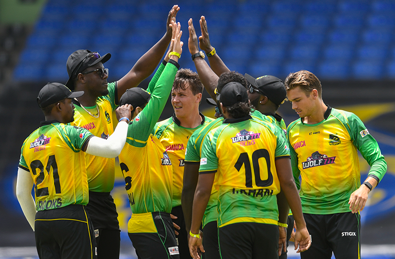 Sharmarh Brooks (L), Carlos Brathwaite (2L), Migael Pretorius (C) and Chris Green (R) of Jamaica Tallawahs celebrates the dismissal of Rahkeem Cornwall of Saint Lucia Kings during the 2021 Hero Caribbean Premier League match 3 between Jamaica Tallawahs and Saint Lucia Kings at Warner Park Sporting Complex on August 27, 2021 in Basseterre, St Kitts, Saint Kitts and Nevis. (Photo by Randy Brooks - CPL T20/Getty Images)