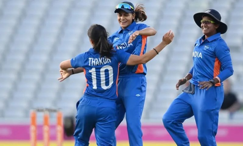 Radha Yadav and Deepti Sharma celebrate a wicket with Renuka Singh Thakur  ( Getty Images)