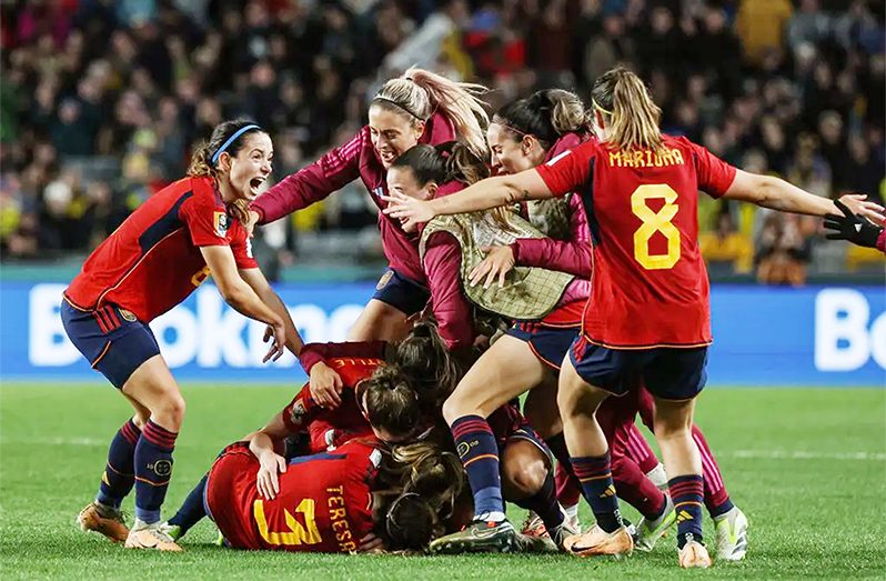 Spain’s players celebrate after Spain’s defender #19 Olga Carmona (unseen) scored her team’s second goal during the Australia and New Zealand 2023 Women’s World Cup semi-final football match between Spain and Sweden at Eden Park in Auckland on August 15, 2023. (Photo by Marty MELVILLE / AFP