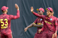 Brandon King and Ackeem Auguste celebrate a wicket • AFP/Getty Images