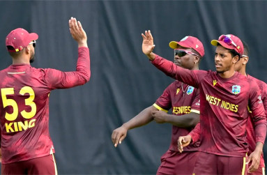 Celebrate Brandon King and Ackeem Auguste celebrate a wicket • AFP/Getty Images