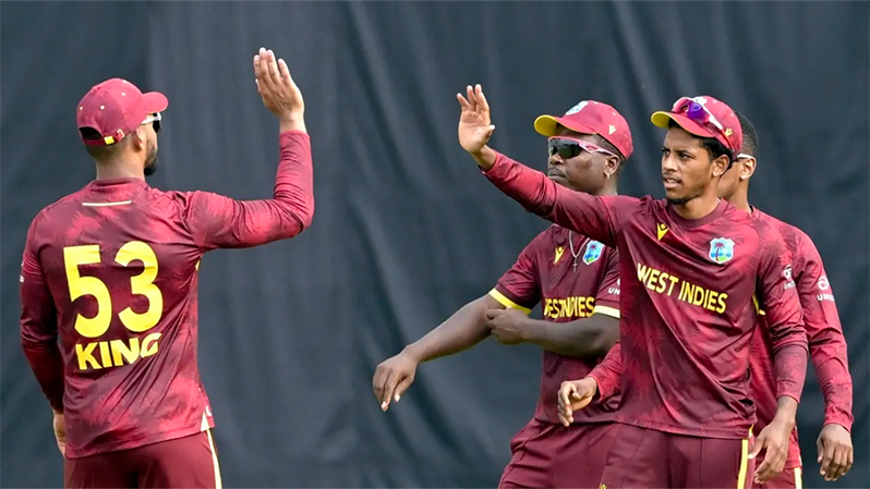 Brandon King and Ackeem Auguste celebrate a wicket • AFP/Getty Images