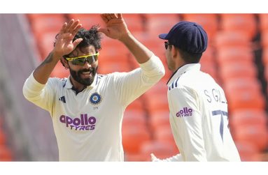 Player-of-the-Match Ravendra Jadeja (left) and India captain Shubman Gill celebrate the fall of another West Indian wicket.
