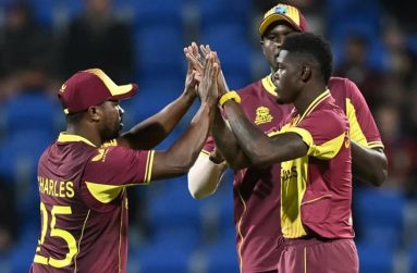 Alzarri Joseph celebrates with team-mates after getting Regis Chakabva  (ICC via Getty Images)
