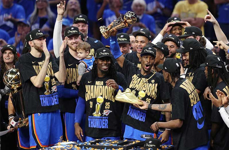 Thunder guard Shai Gilgeous-Alexander celebrates with his team after they won the NBA championship Sunday night