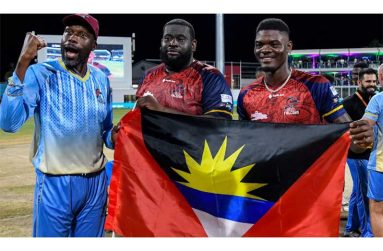 Sir Curtly Ambrose (left) celebrates with players Rahkeem Cornwall (centre) and Alzarri Joseph after winning the CPL title