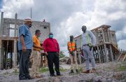 CEO of CH&PA, Sherwyn Greaves (centre), with other officials of the Housing and Water Ministry during a visit to the construction site of the middle-income housing