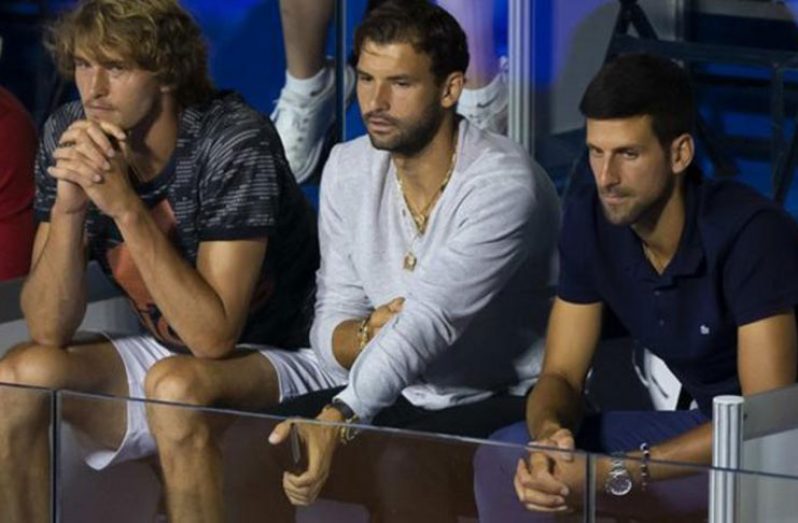 Grigor Dimitrov (centre) sat with Alexander Zverev and Novak Djokovic during the first Adria Tour event in Belgrade last week