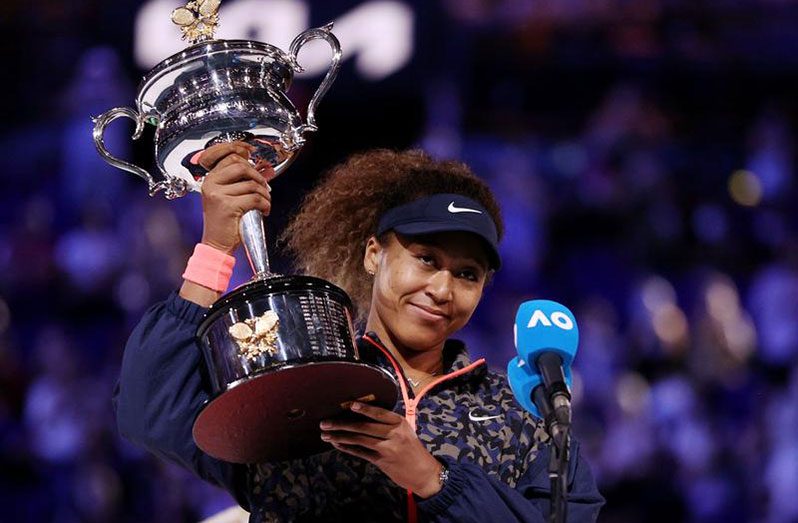 Japan's Naomi Osaka gives an interview as she celebrates with the trophy after winning the Australian Open against Jennifer Brady of the U.S, yesterday. (REUTERS/Loren Elliott)