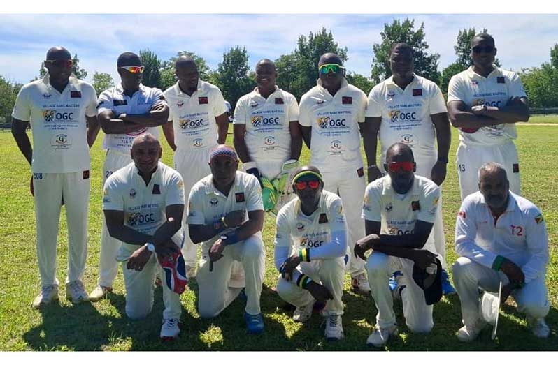 The champions posing for the camera with Kallicharran on the right, stooping