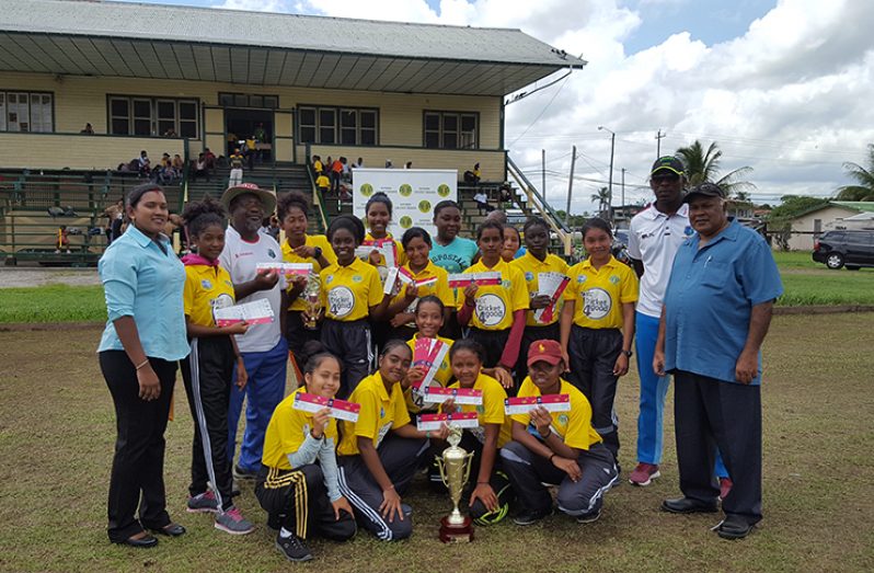 The winning Essequibo team along with GCB's acting president, Fizul Bacchus, and GCB's TDO Admin Assistant, Kavita Yadram.