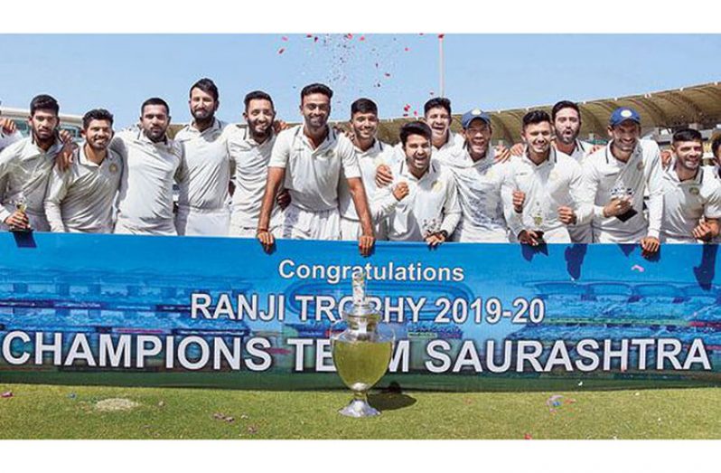 Some of the Saurashtra players after winning the Ranji Trophy on Fridaylast  (PTI)
