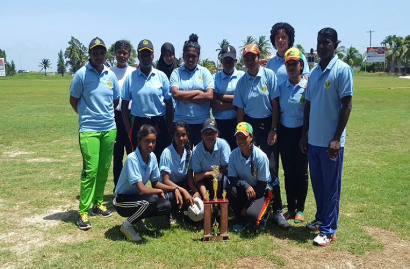 Winners: the Demerara team with manager Heema Singh (far left) and coach Latchman Yadram (far left)