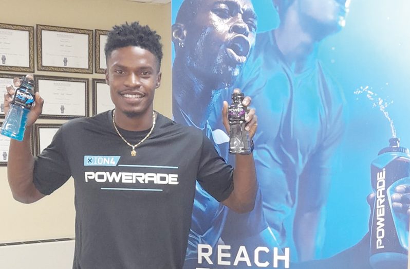 New PowerAde Brand Ambassador, Arinze Chance, following his signing with the sport drink that's distributed by Banks DIH. (Rawle Toney photo)