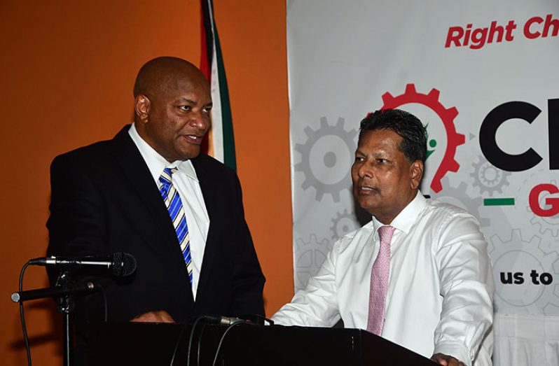 Chairman of Change Guyana, Nigel Hinds (left) and Presidential Candidate of Change Guyana, Robert Badal, (right) in discussion prior to the press conference on Tuesday (Adrian Narine photo)