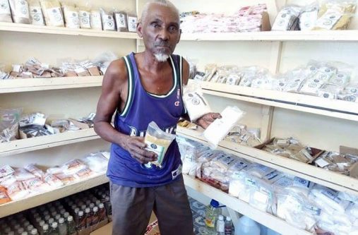 Mr. John Caesar in his shop