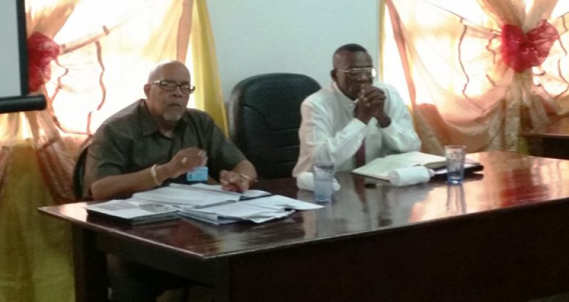 GWI Chief Executive, Dr Richard Van West-Charles addresses the meeting as Region 10 Chairman Renis Morian pay rapt attention
