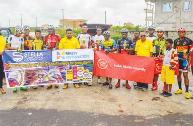 Prize winners of the various categories  strike a pose with race coordinator Hassan Mohamed ((fifth right), Massy’s Seven Seas Brand Manager Nirvana Thakur (extreme right), Dr Chase’s Brand representative Claude Dhanraj and the company’s Pharmaceutical Manager Karen Connell (extreme left). (Samuel Maughn photo)