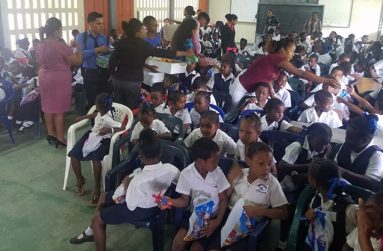 Party bags being presented to children at Queenstown Primary School