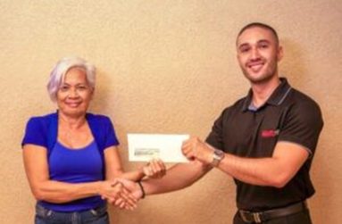 Gabriel Beharry (right), BAL Marketing Manager, presents the sponsorship cheque to Cheryl Gonsalves of the Guyana Motor Racing and Sports Club