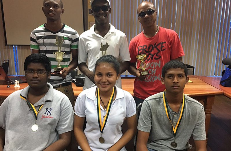Back row (from left) CM Anthony Drayton, CM Wendell Meusa and Chino Chung; sitting (from left) best juniors - Joshua Gopaul, Nelisha Johnson, and Andre Jagnandan
