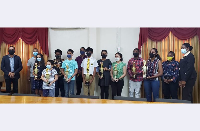 The winners of the respective divisions collected their prizes yesterday at the Region Four’s RDC head office on the East Coast.
