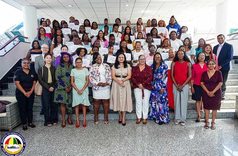 Minister Dr. Vindhya Persaud (centre) flanked by graduates from the Ministry of Human Services and Social Security’s Early Childhood Development (ECD) programme