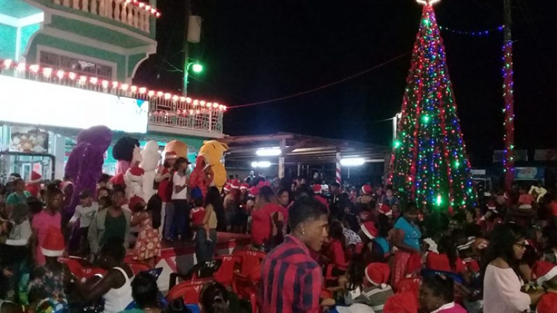 Children gathered at G&P Jaigobin’s Christmas tree light up