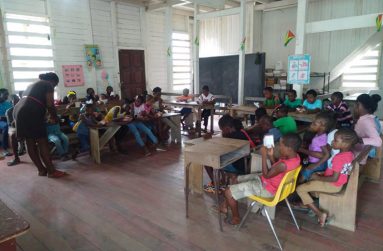 Children in classroom exercise hosted by All God’s Little Children Inc