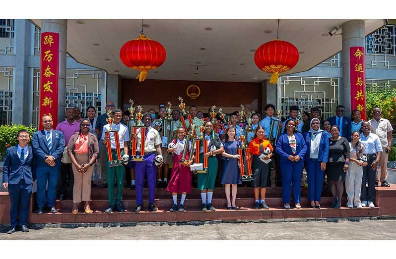 Director of the Unit of Allied Arts Nicholas Fraser, DCEO-Administration Tiffany Harvey, and China’s Ambassador to Guyana, Yang Yang, flanked by winners and other officials at the Chinese Embassy (Elton John photo)