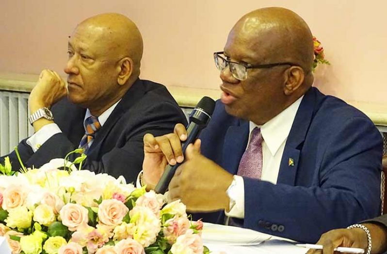 Finance Minister Winston Jordan responding to potential investors in the presence of Guyana's Ambassador to
China, Bayney Karran at the 9th International Infrastructure and Construction Forum on Friday
