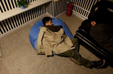 Yu Xiaojian (L) and Li Yan, employees at Goopal Group, take a nap during a break at work around midnight, in Beijing, China, April 19, 2016. REUTERS/Jason Lee