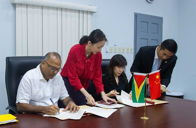 Minister of Health, Dr. Frank Anthony and Chinese Ambassador to Guyana, Her Excellency Yang Yang, sign the MoU, reaffirming over three decades of fruitful collaboration in healthcare