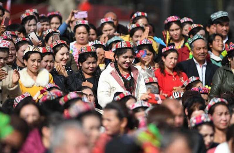 People attend a culture and tourism festival themed on Dolan and Qiuci culture in Awat County of Aksu Prefecture, northwest China's Xinjiang Uygur Autonomous region, Oct. 25, 2019. (Photo: Xinhua)