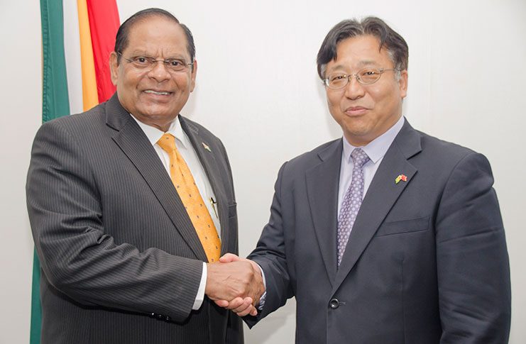 Prime Minister, Moses Nagamootoo, (left) and Ambassador of the People’s Republic of China, Cui Jianchun