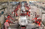 Robotic arms work in a smart workshop of a factory of Chinese new energy vehicle (NEV) manufacturer Leapmotor in Jinhua, east China's Zhejiang province, May 13, 2025 (Photo by Shi Bufa/People's Daily Online)