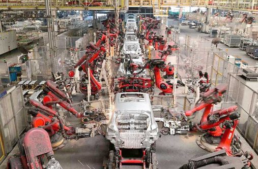 Robotic arms work in a smart workshop of a factory of Chinese new energy vehicle (NEV) manufacturer Leapmotor in Jinhua, east China's Zhejiang province, May 13, 2025 (Photo by Shi Bufa/People's Daily Online)