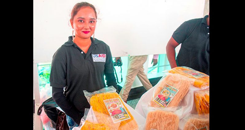 Naiomi and her chowmein noodles at a recent exhibition where she graduated from the government’s Sustainable Livelihood Entrepreneurial Development (SLED) initiative.