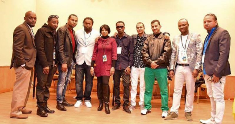 Chris and Michael (third and fourth from right) with representatives of HUGE Entertainment.