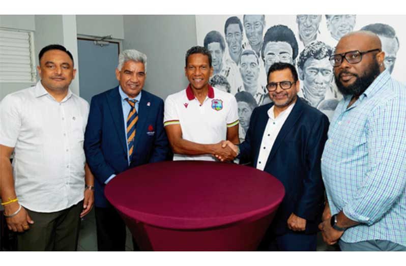 CEO of CWI, Chris Dehring (centre) and President of Cricket Canada, Arvinder Khosa (second right) shake hands during a recent meeting